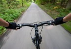 Biking on the road in forest